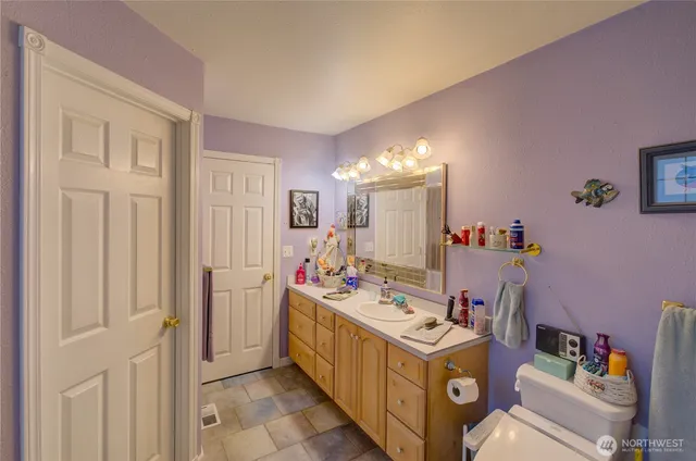 a kitchen with a stove and a refrigerator