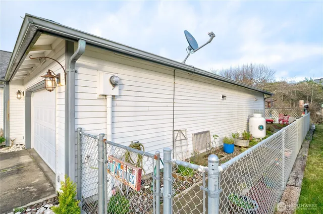 a front view of house along with deck and outdoor seating