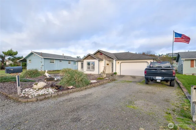 a view of a house with a yard and sitting area