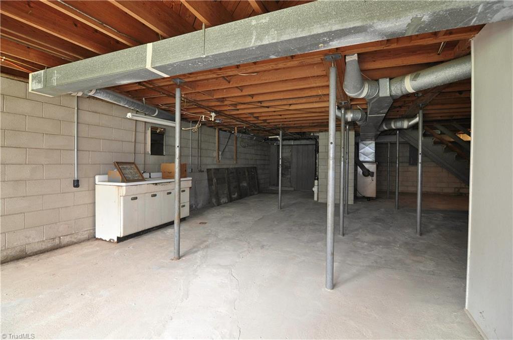 2823 Enterprise Road Lexington, NC 27295 - Photo 19 of 24 Daylight basement has rough plumbing in place for future kitchen and bathroom space. Could be a perfect in-law or teenage space.