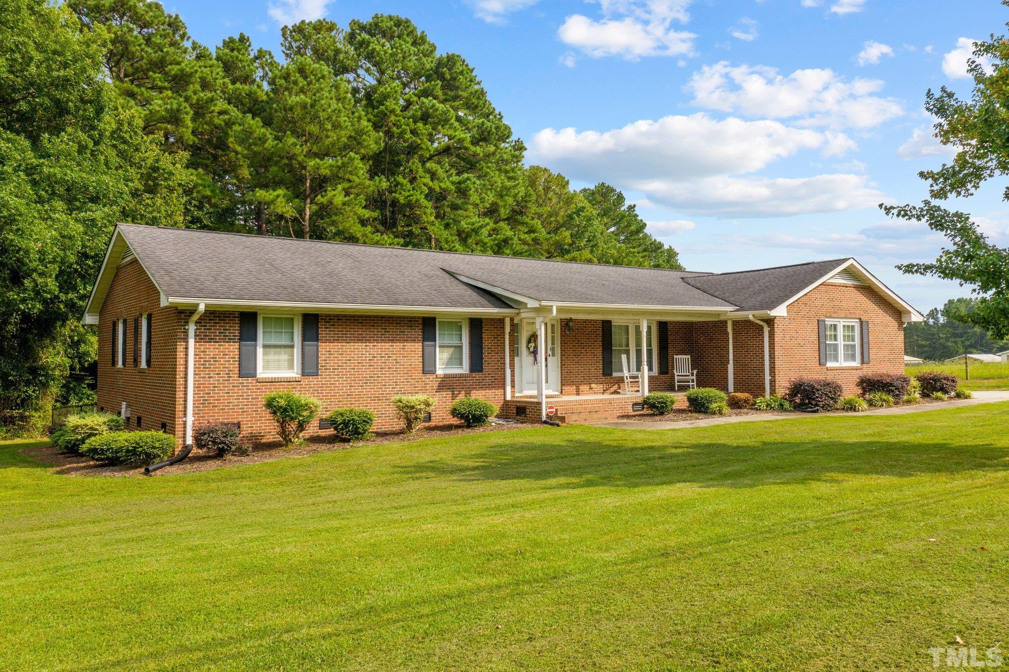 705 Sherron Road Durham, NC 27703 - Photo 1 of 28 a front view of a house with swimming pool having outdoor seating