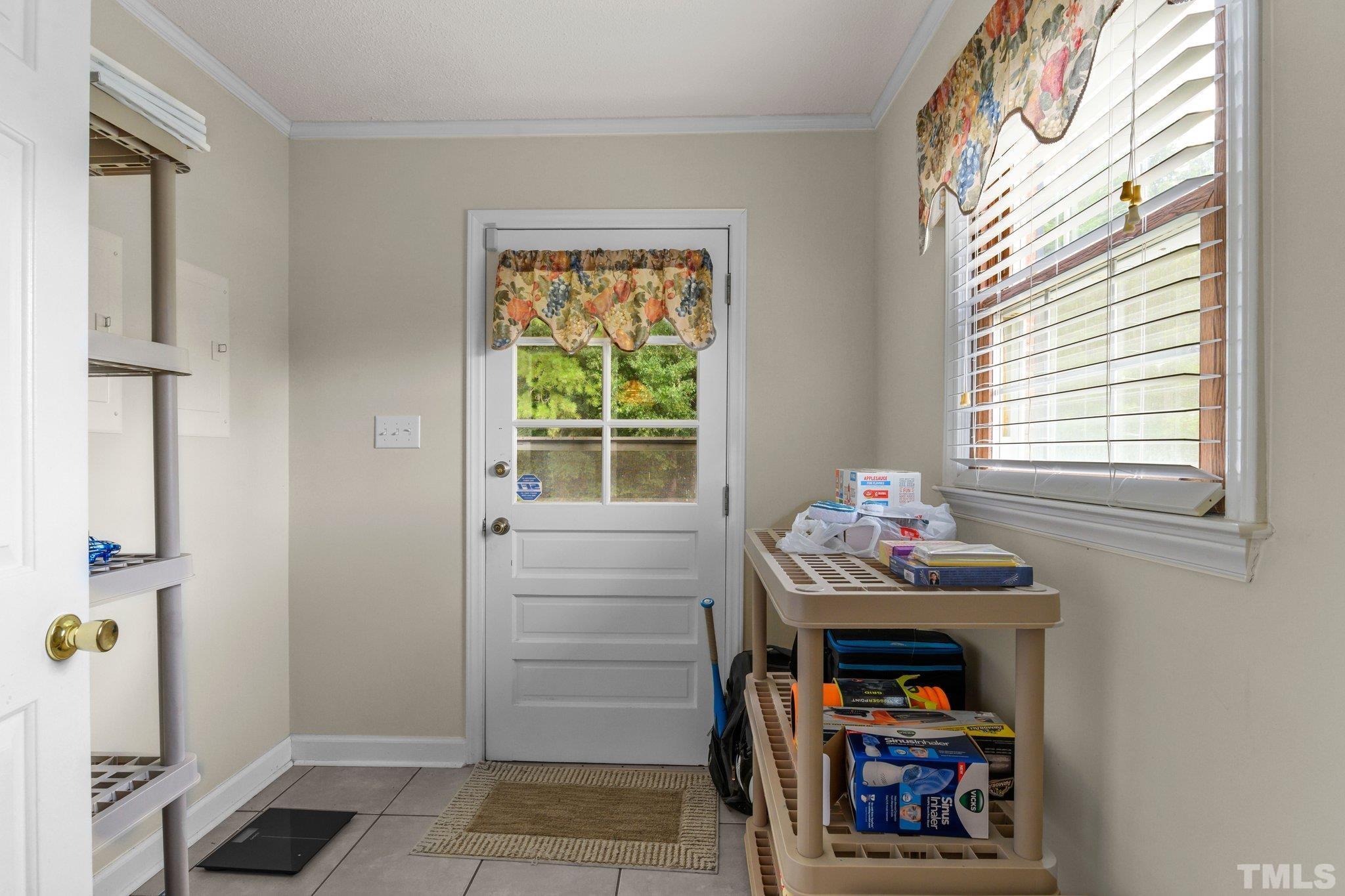 705 Sherron Road Durham, NC 27703 - Photo 19 of 28 a bedroom with a bed and a window