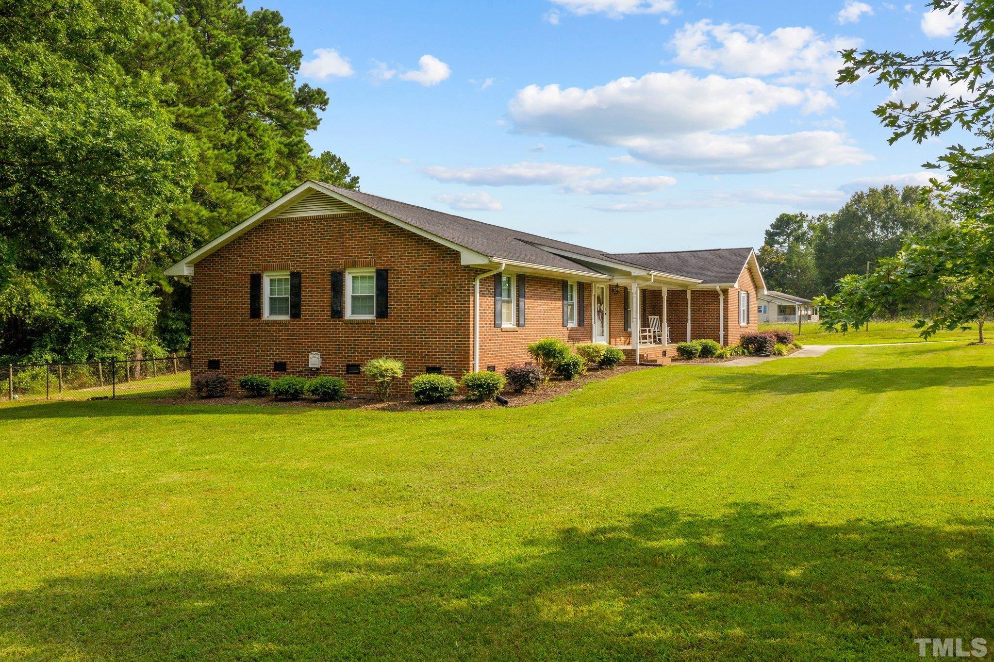 705 Sherron Road Durham, NC 27703 - Photo 3 of 28 a front view of a house with garden