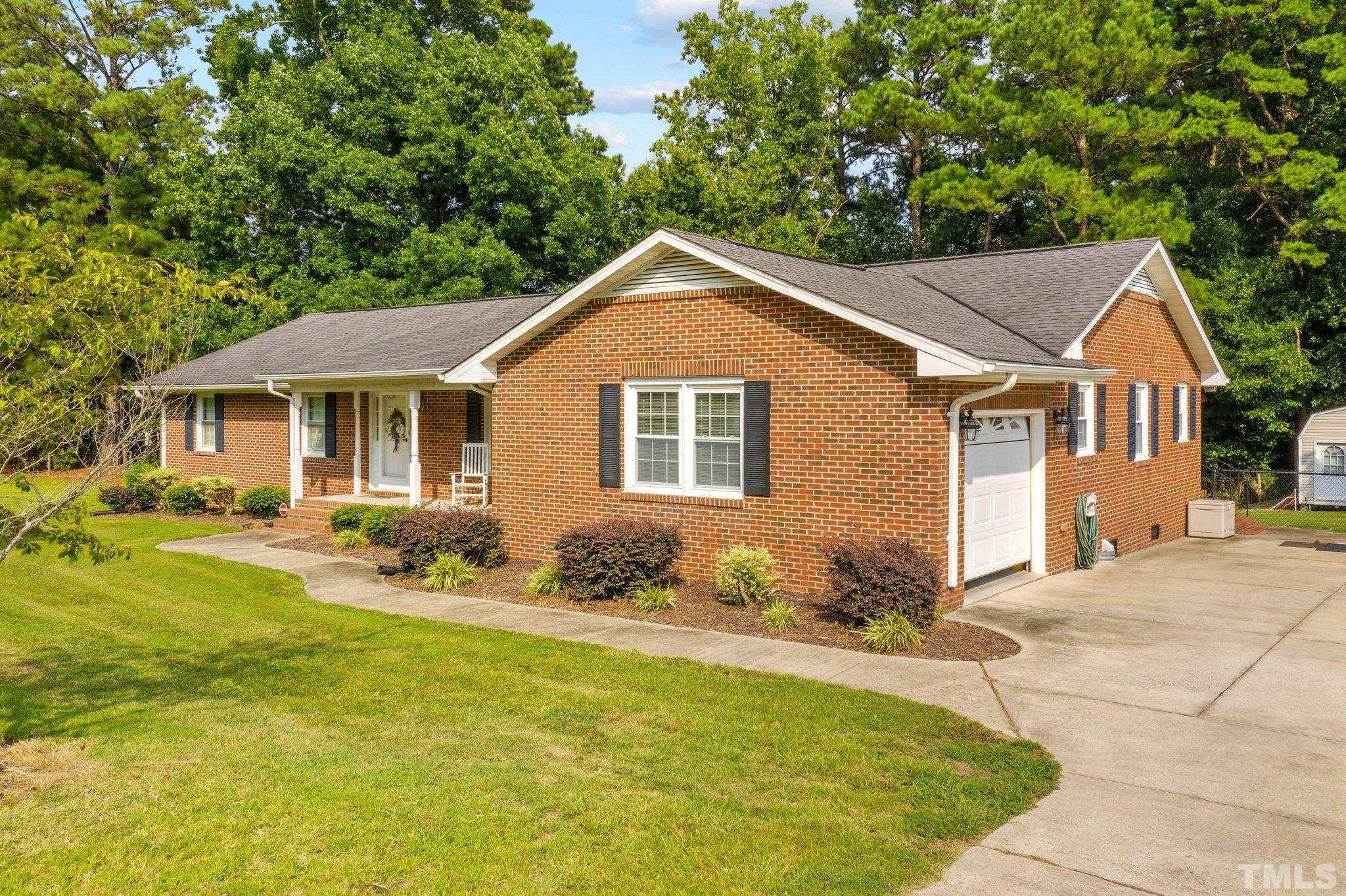 705 Sherron Road Durham, NC 27703 - Photo 4 of 28 a front view of a house with a yard