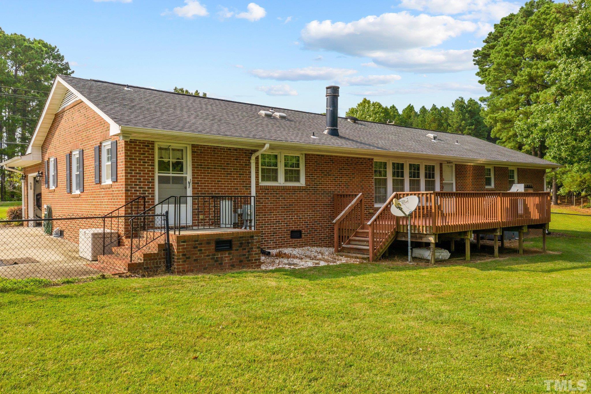 705 Sherron Road Durham, NC 27703 - Photo 8 of 28 a view of a house with backyard porch and sitting area