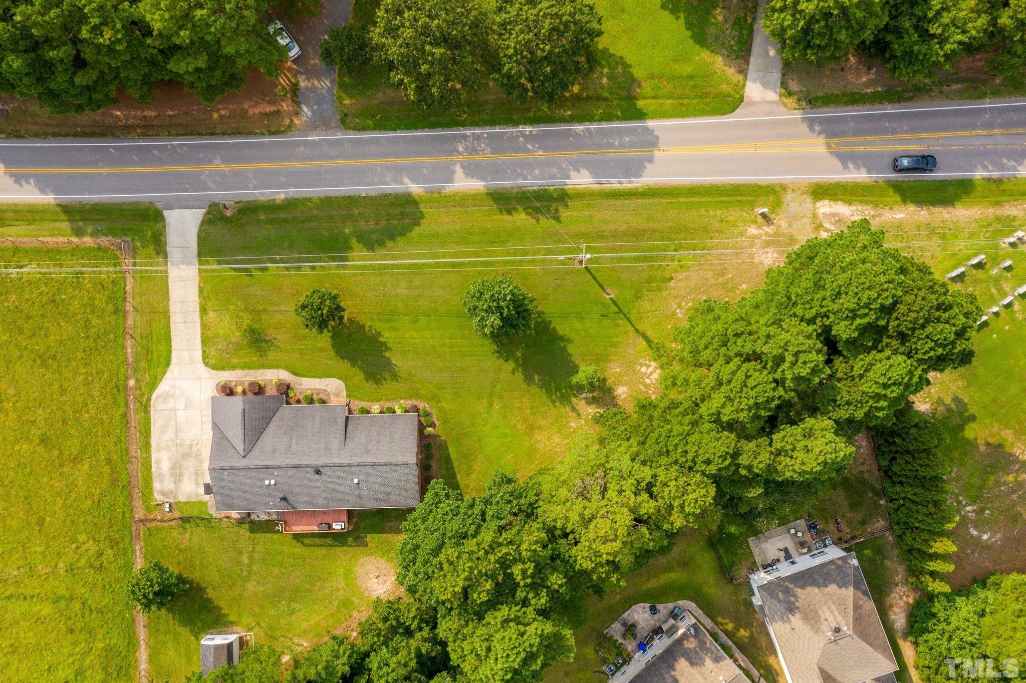 705 Sherron Road Durham, NC 27703 - Photo 9 of 28 a view of a swimming pool with a yard