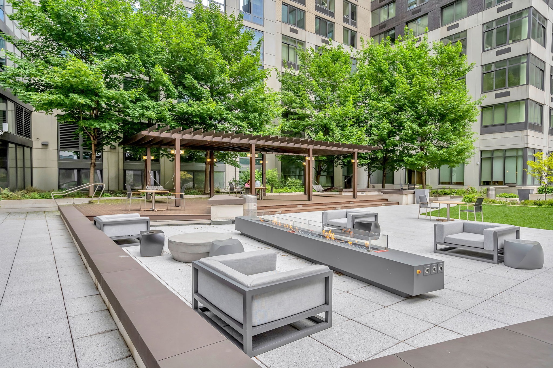 60 Riverside Boulevard, Unit 1810 Manhattan, NY 10069 - Photo 9 of 19 a view of a building with a couches in a patio