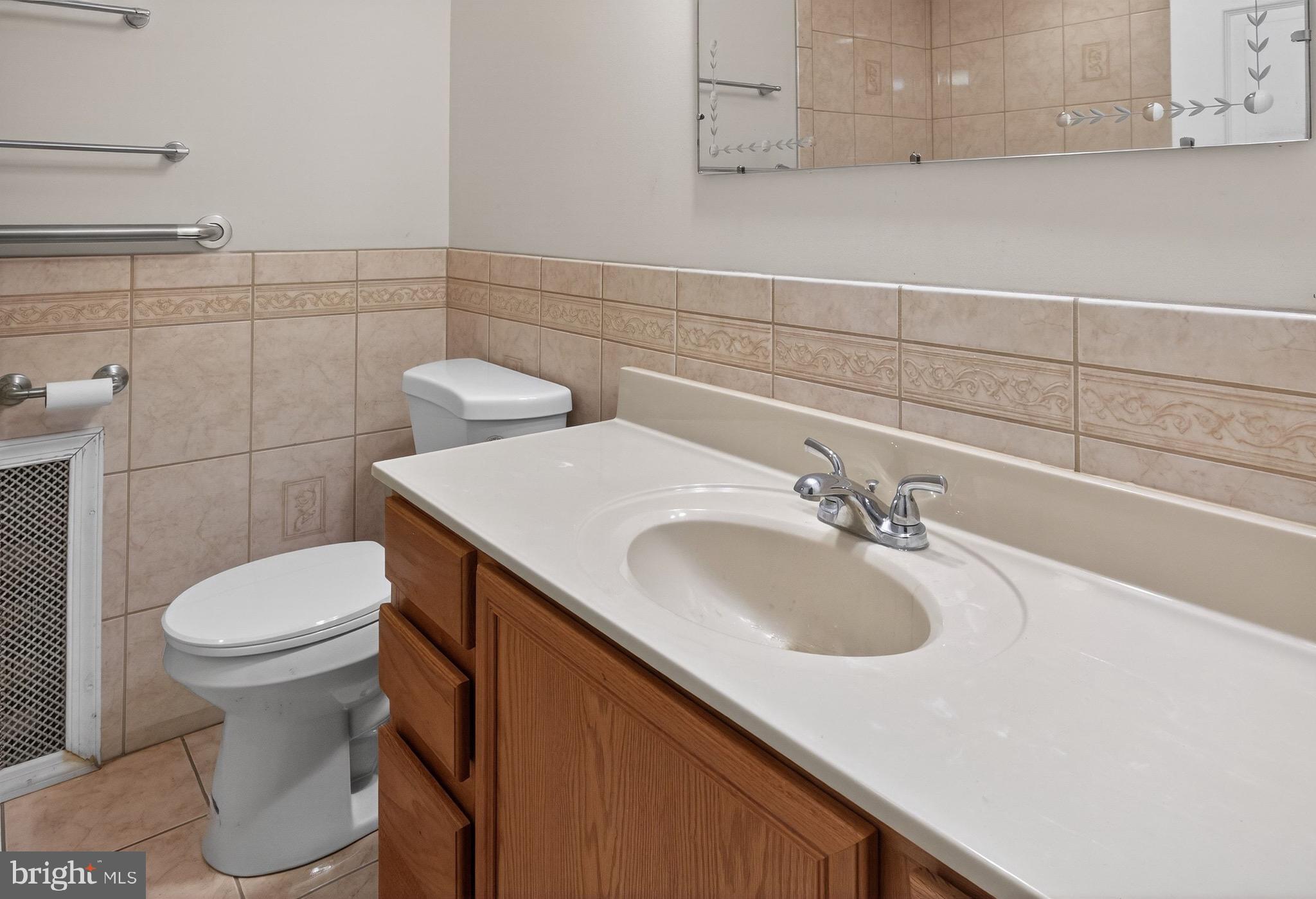 764 Lakehurst Road Browns Mills, NJ 08015 - Photo 12 of 36 a bathroom with a sink and a toilet