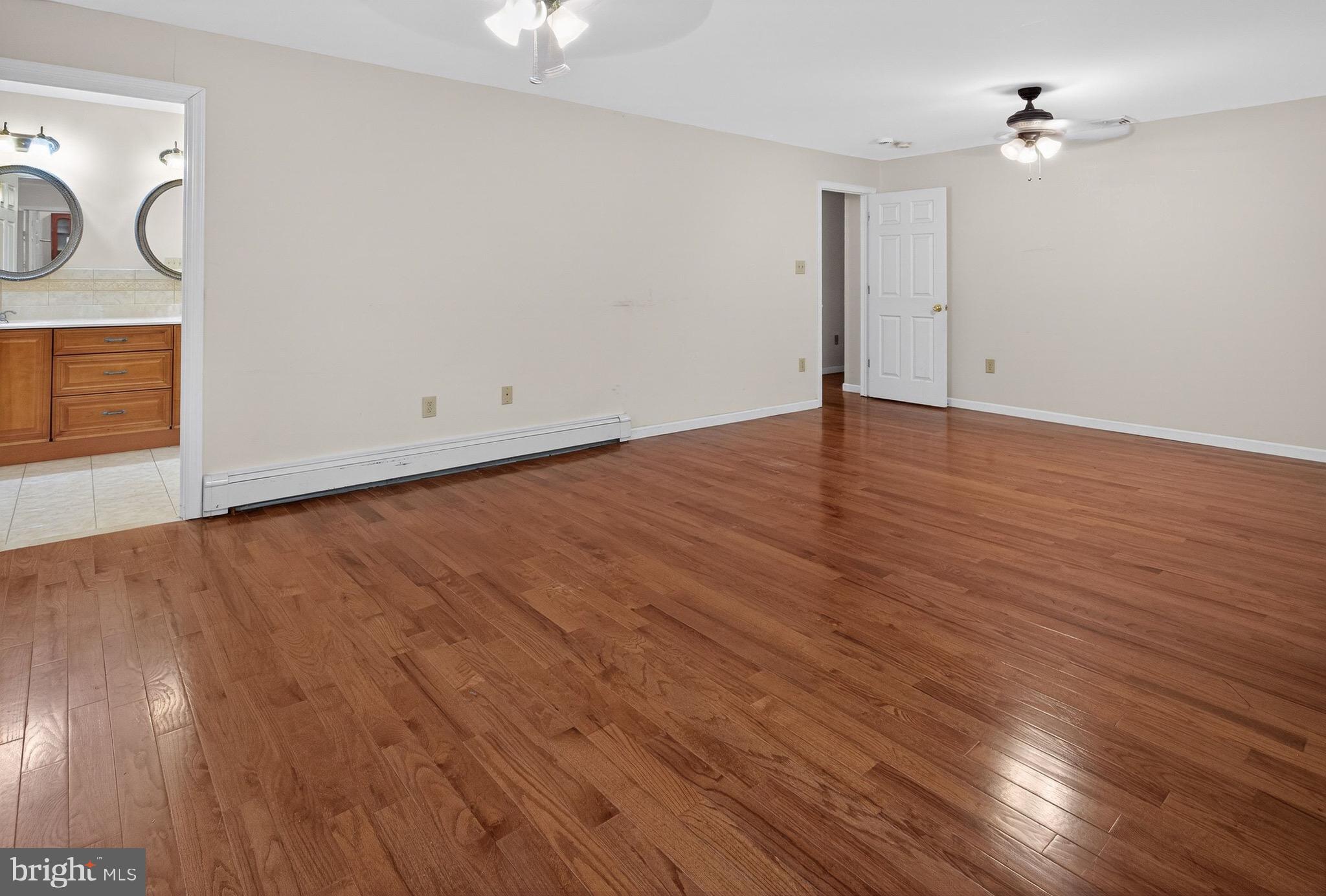 764 Lakehurst Road Browns Mills, NJ 08015 - Photo 15 of 36 a view of empty room with wooden floor