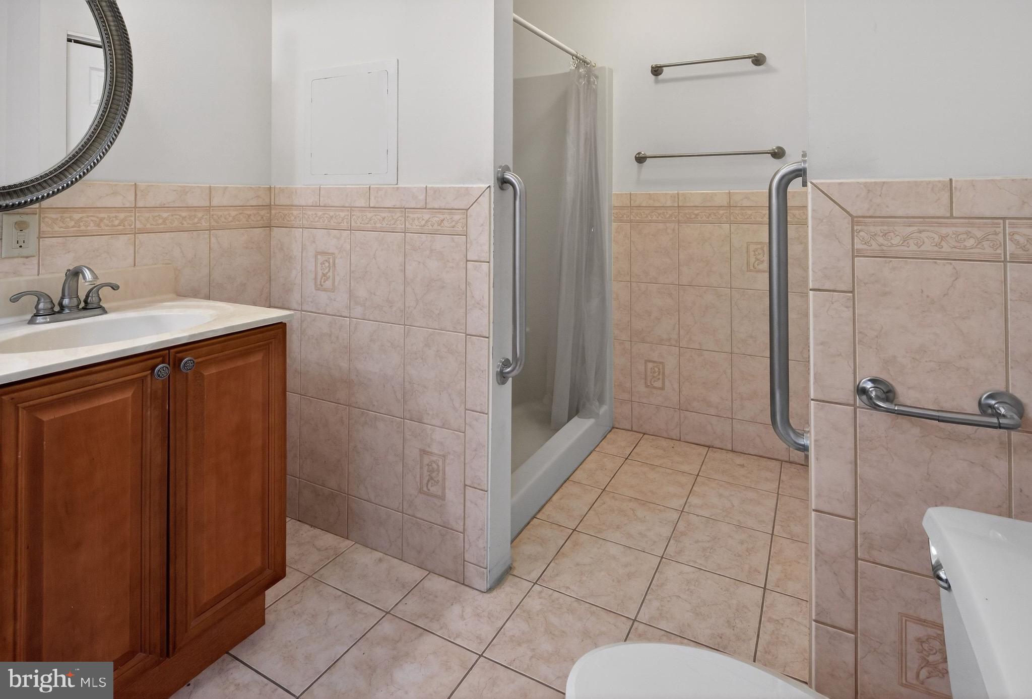 764 Lakehurst Road Browns Mills, NJ 08015 - Photo 17 of 36 a bathroom with a sink and mirror