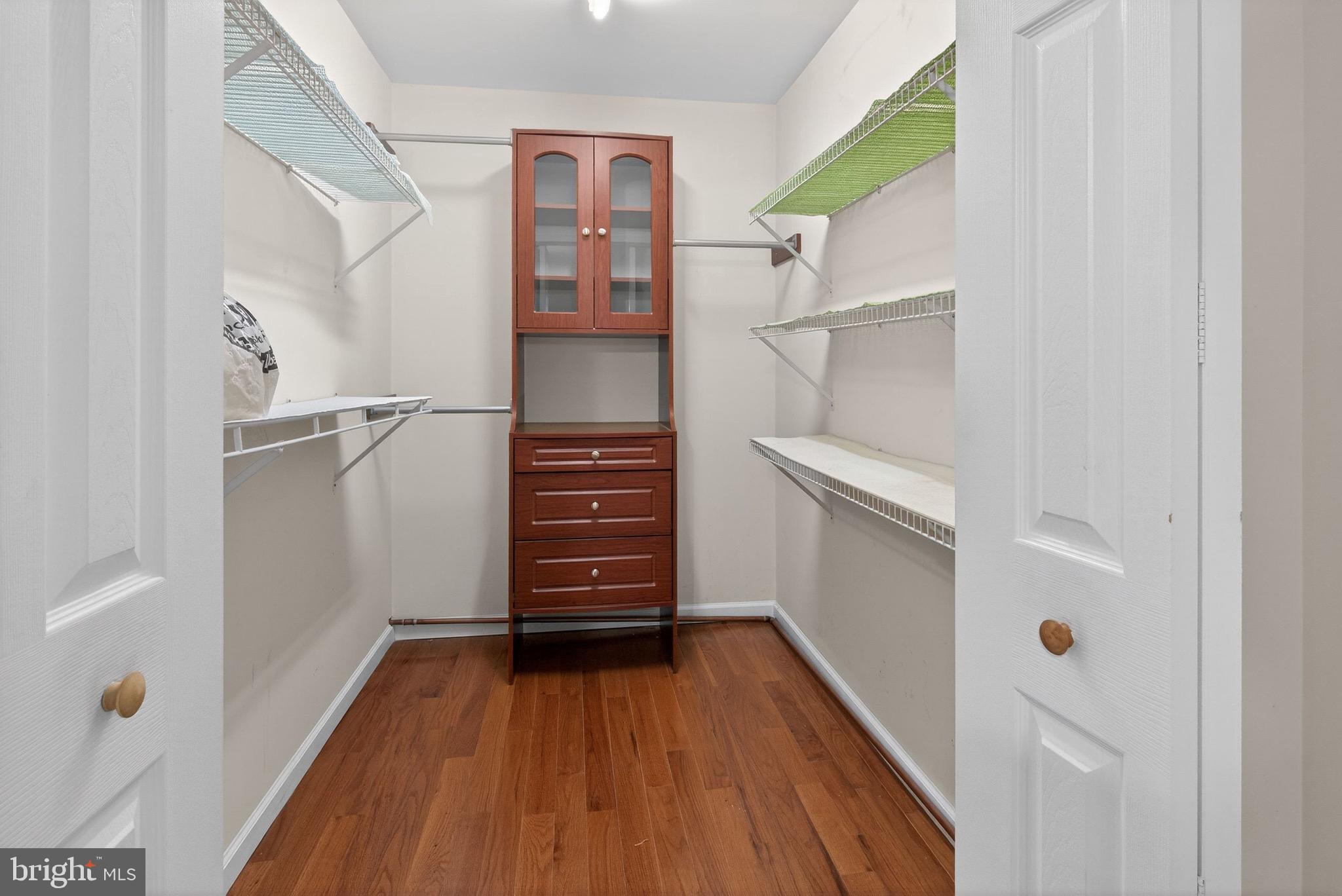 764 Lakehurst Road Browns Mills, NJ 08015 - Photo 18 of 36 a view of walk in closet with furniture and wooden floor