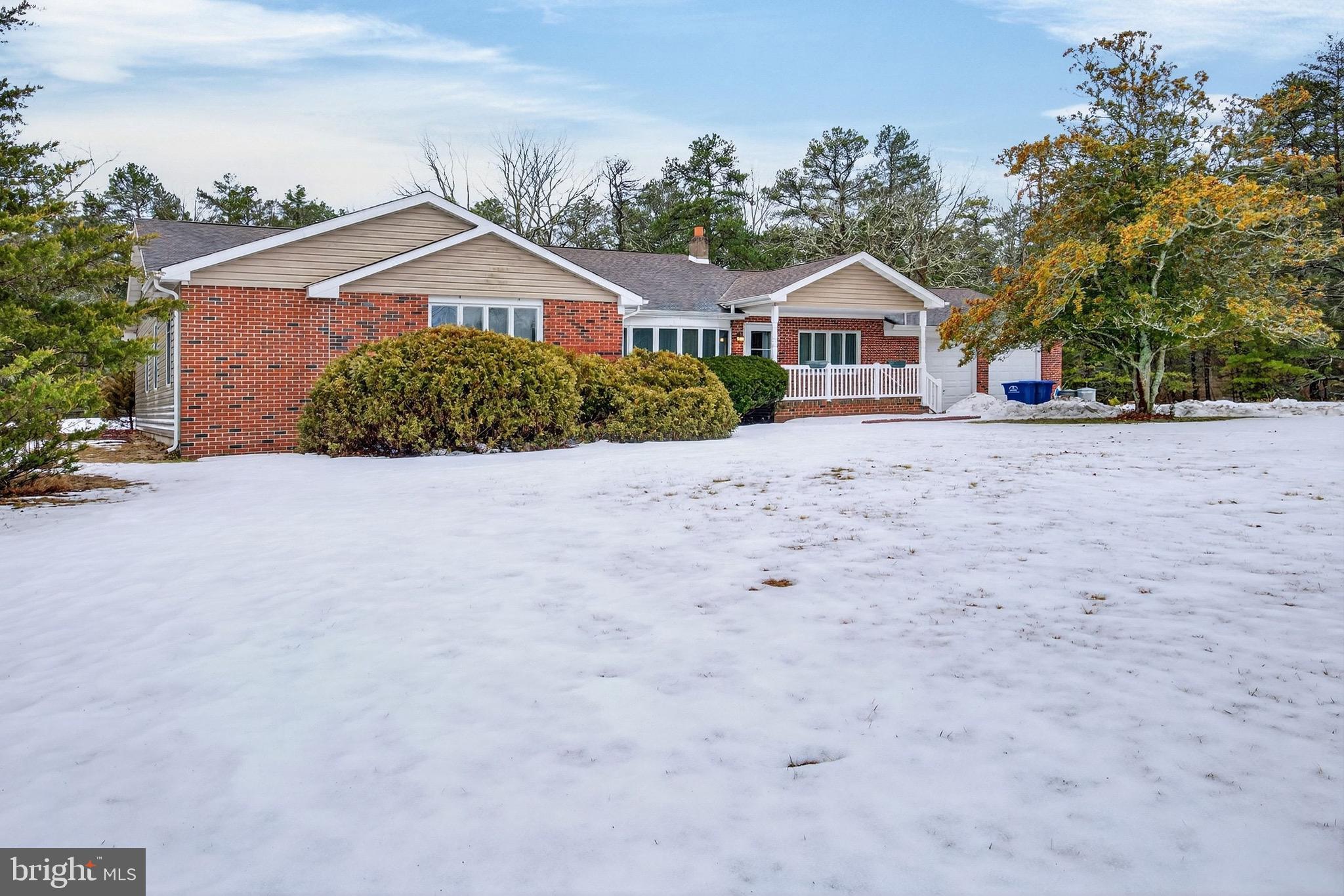 764 Lakehurst Road Browns Mills, NJ 08015 - Photo 2 of 36 a house with trees in front of it