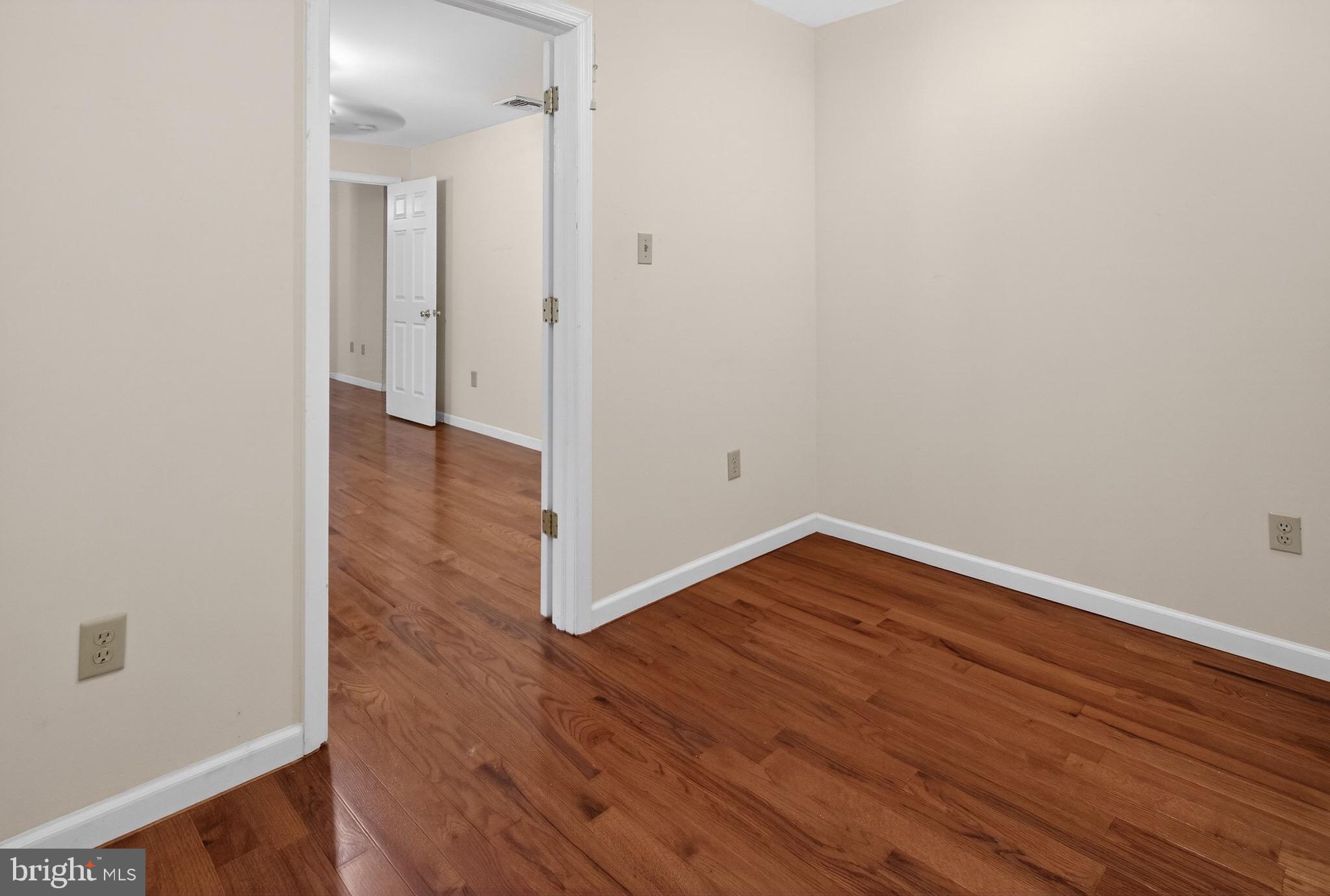 764 Lakehurst Road Browns Mills, NJ 08015 - Photo 21 of 36 wooden floor in an empty room