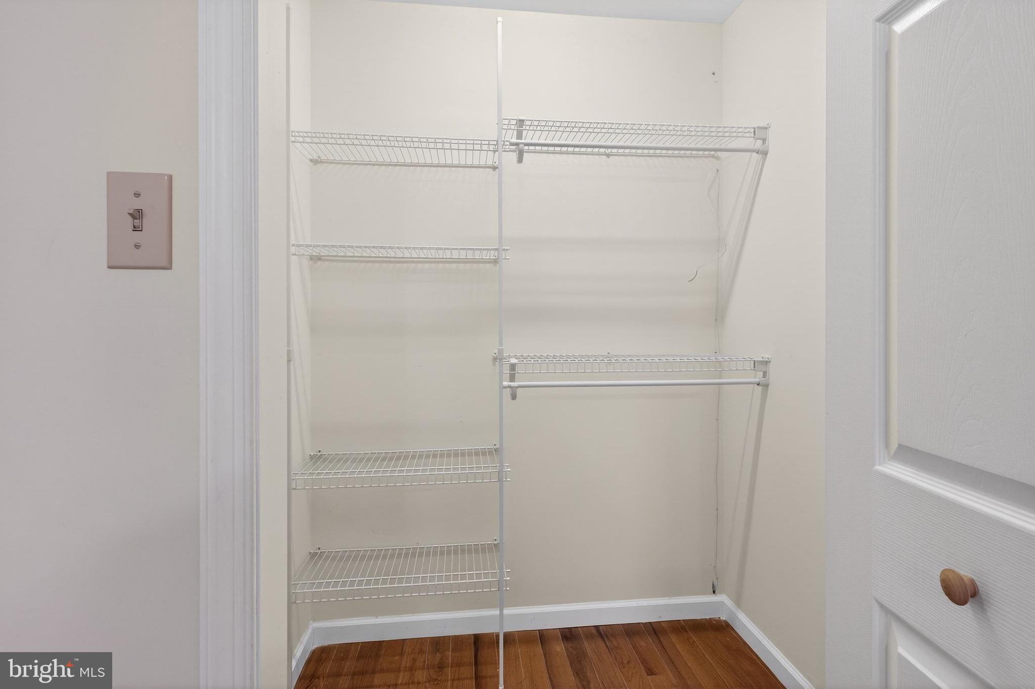 764 Lakehurst Road Browns Mills, NJ 08015 - Photo 24 of 36 a view of walk in closet with empty racks
