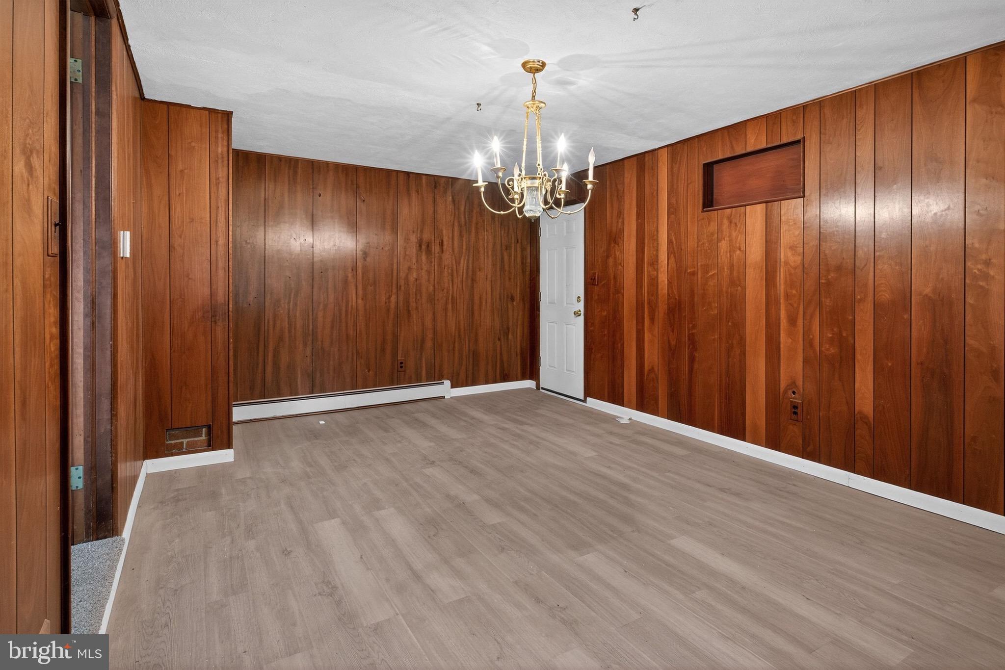 764 Lakehurst Road Browns Mills, NJ 08015 - Photo 27 of 36 a view of a chandelier in an empty room