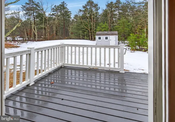 a balcony with a table and chairs