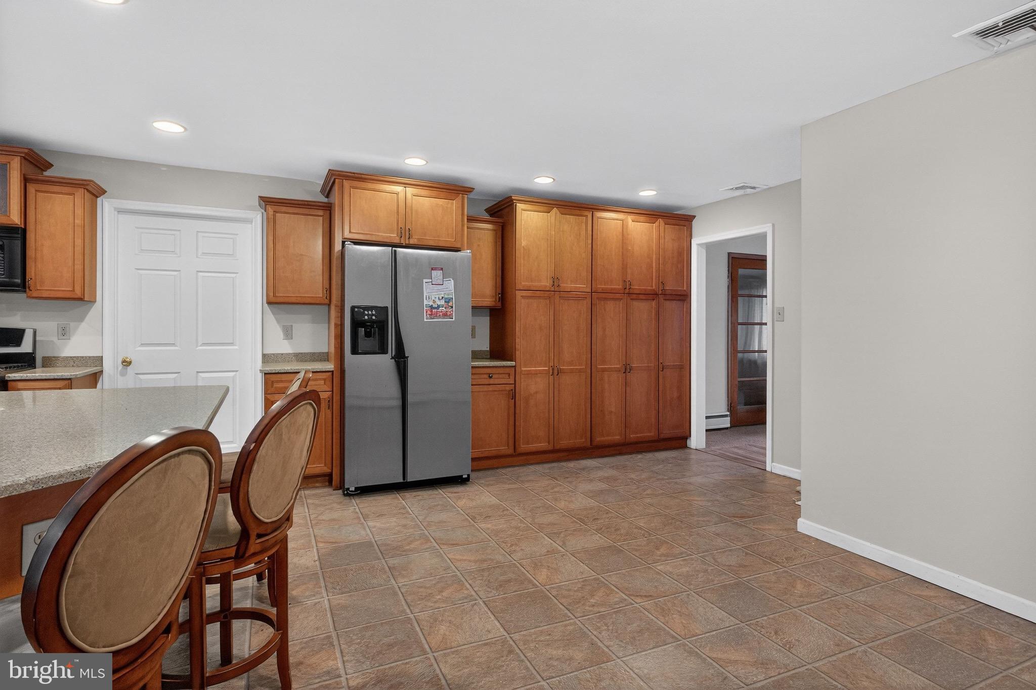 764 Lakehurst Road Browns Mills, NJ 08015 - Photo 8 of 36 a kitchen with stainless steel appliances granite countertop a refrigerator and a stove top oven