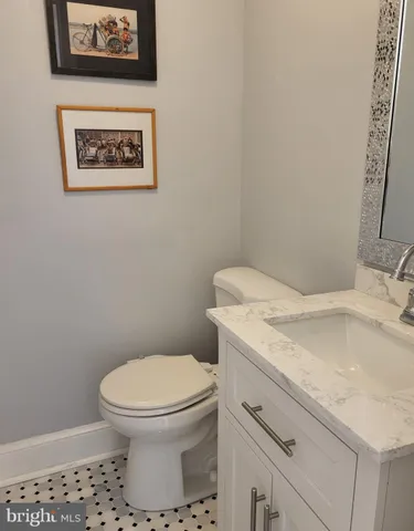a bathroom with a toilet and a sink
