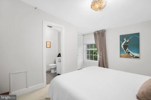 a bathroom with a sink a toilet and a vanity