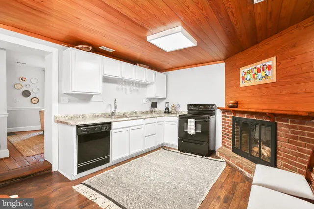 a front view of a fireplace with wooden floor