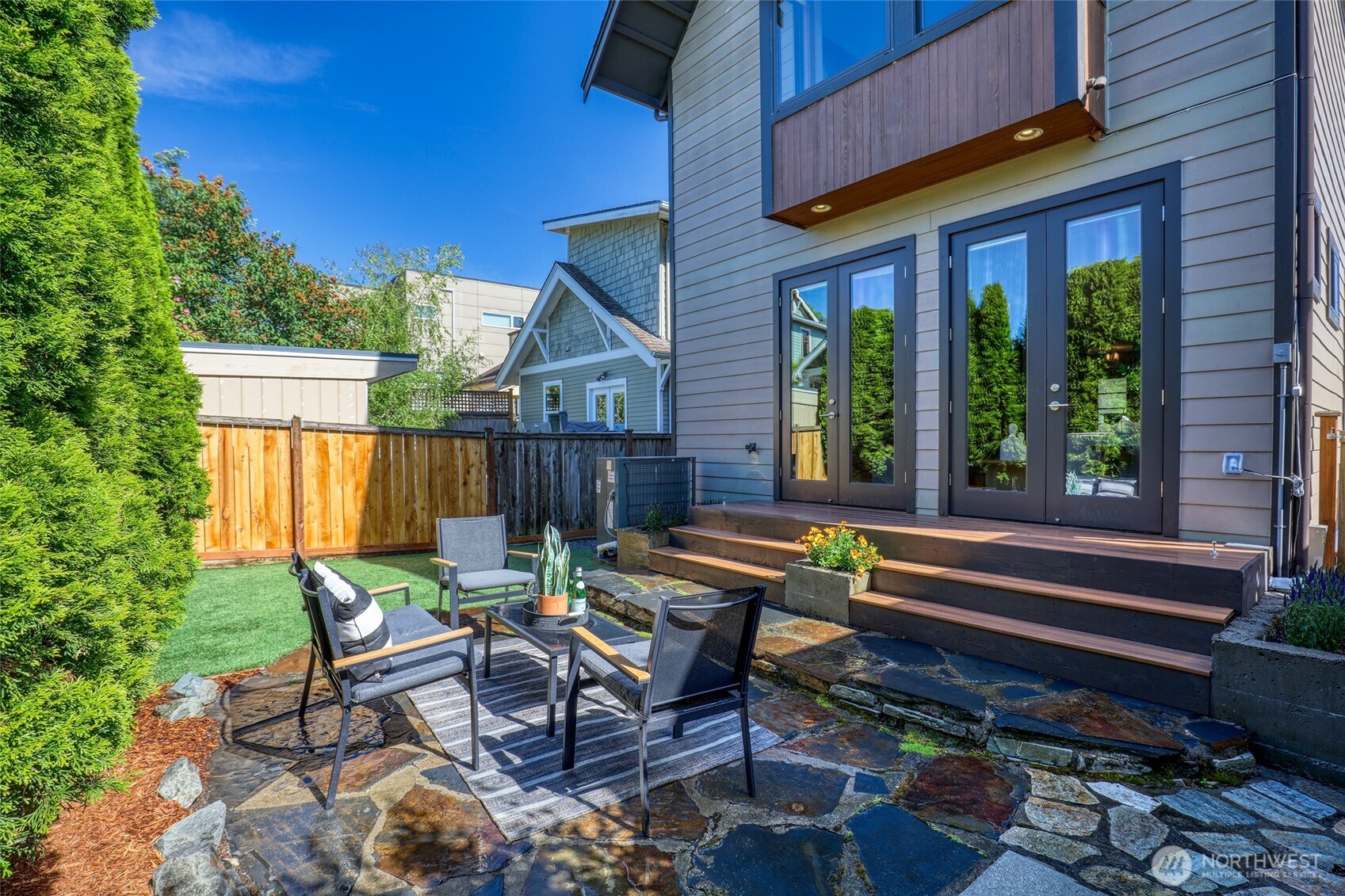 2334 North 57th Street Seattle, WA 98103 - Photo 12 of 27 a wooden bench sitting in front of a building