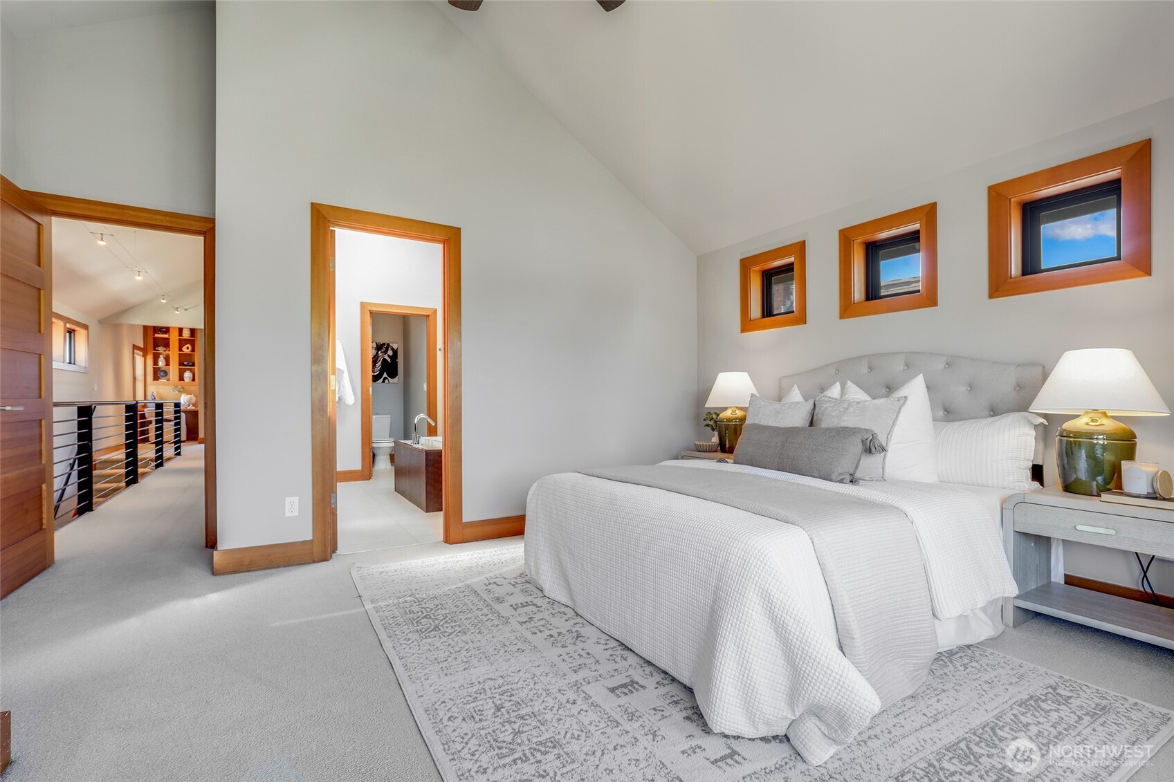 2334 North 57th Street Seattle, WA 98103 - Photo 17 of 27 a bedroom with a bed and a lamp