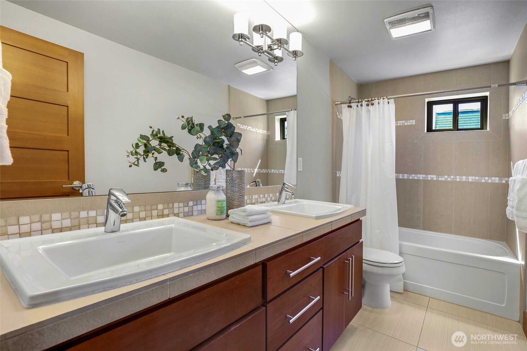 2334 North 57th Street Seattle, WA 98103 - Photo 22 of 27 a bathroom with a sink a toilet and shower