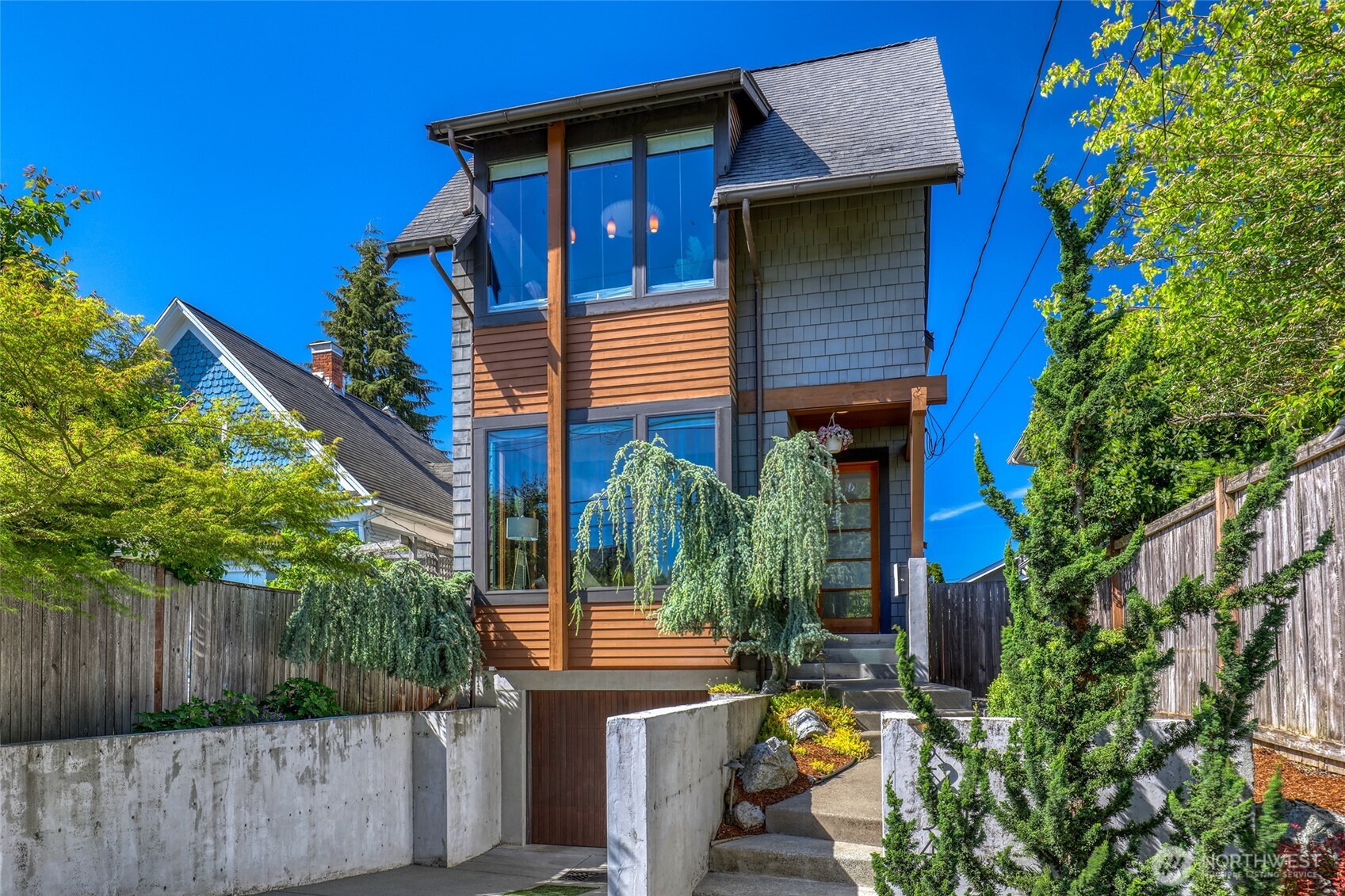 2334 North 57th Street Seattle, WA 98103 - Photo 24 of 27 a view of a house with sitting area and potted plants