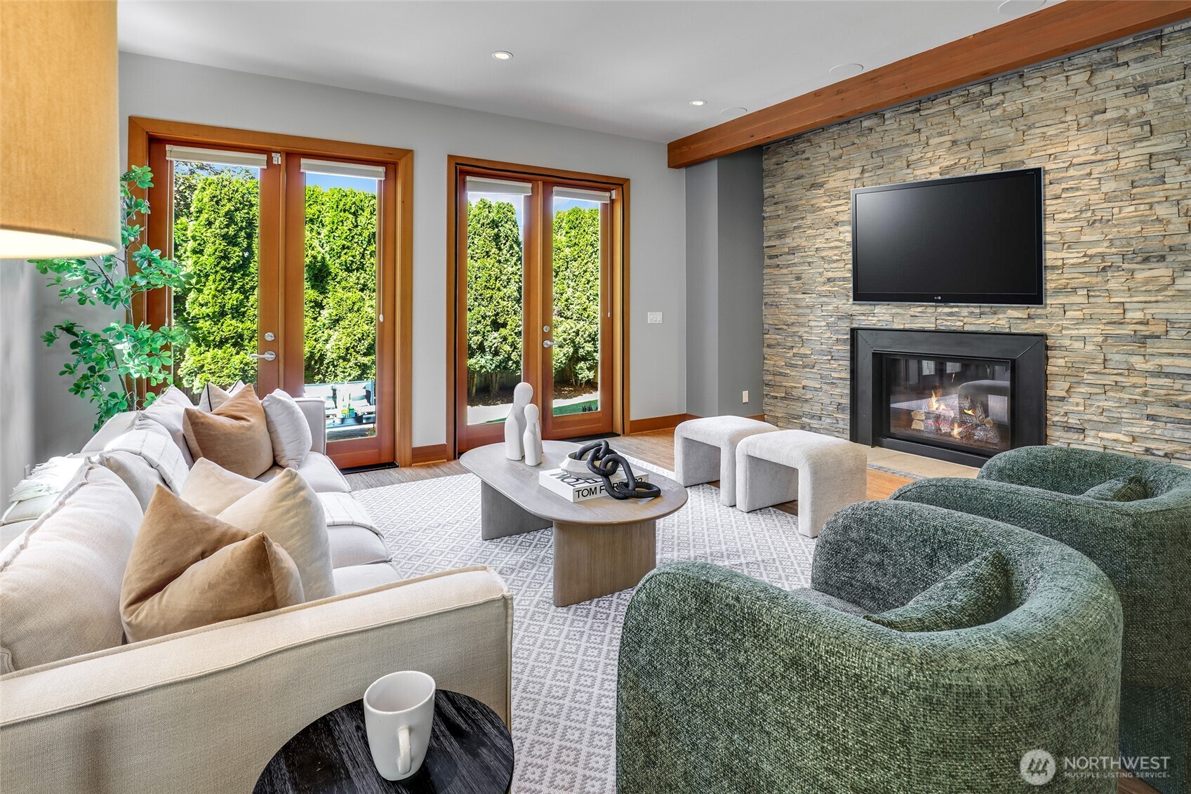 2334 North 57th Street Seattle, WA 98103 - Photo 8 of 27 a living room with furniture a flat screen tv and a fireplace