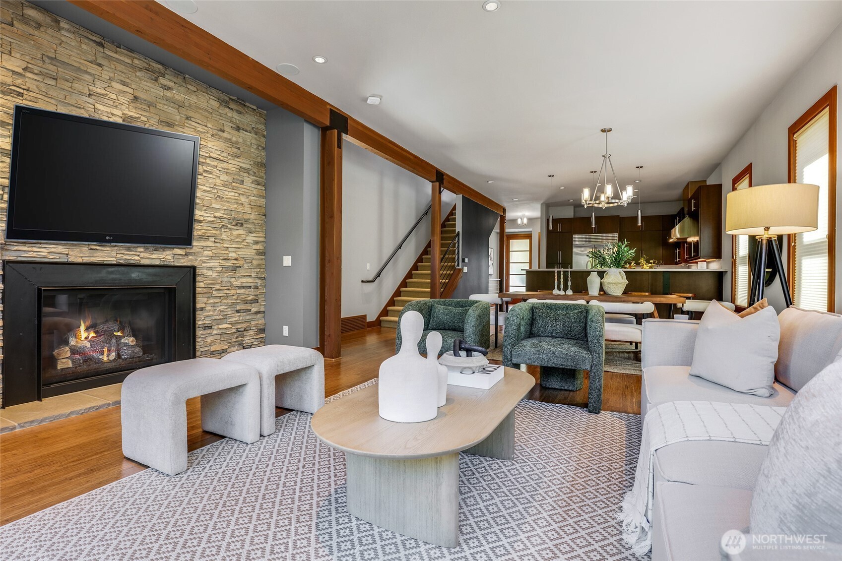 2334 North 57th Street Seattle, WA 98103 - Photo 9 of 27 a living room with furniture a flat screen tv and a fireplace