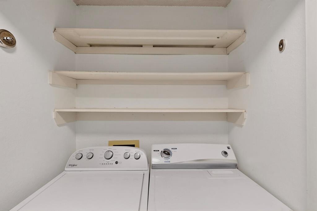 46 Abbey Road Euless, TX 76039 - Photo 11 of 16 Laundry area featuring washer and dryer