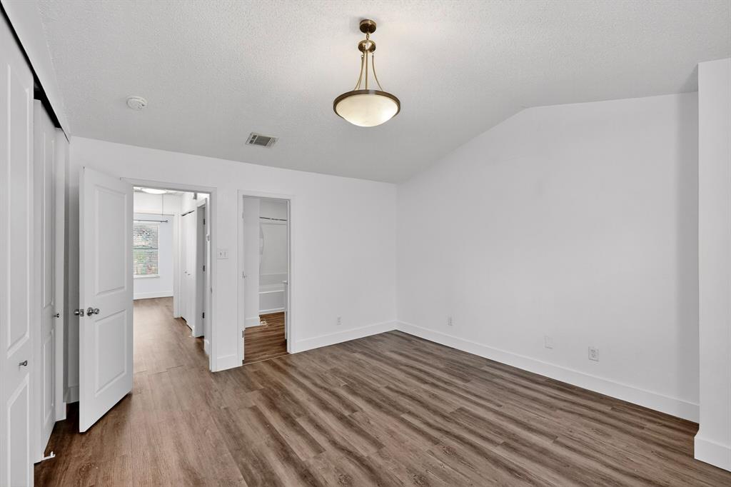 46 Abbey Road Euless, TX 76039 - Photo 10 of 16 Unfurnished bedroom with baseboards and dark wood-style floors