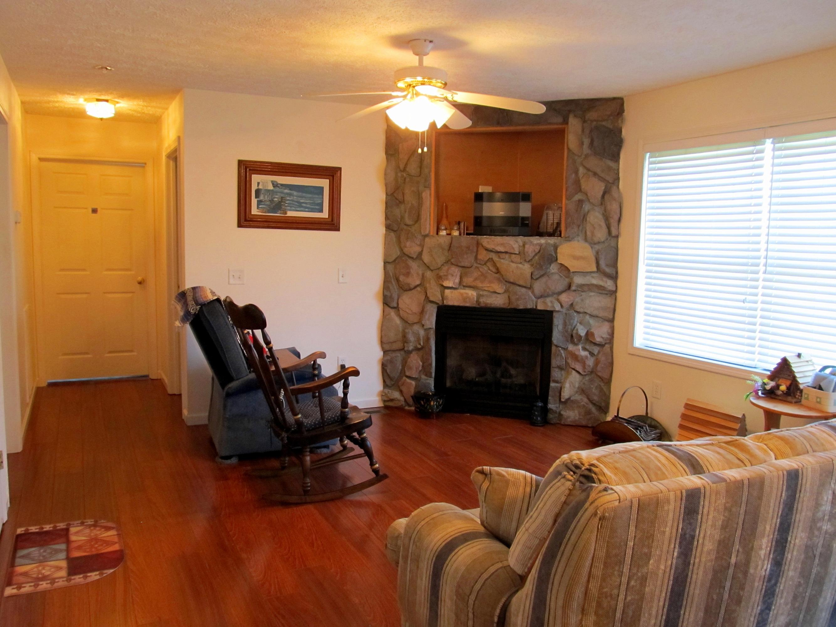 578 Russell Brothers Road Sharps Chapel, TN 37866 - Photo 14 of 39 wood floors and stone fireplace