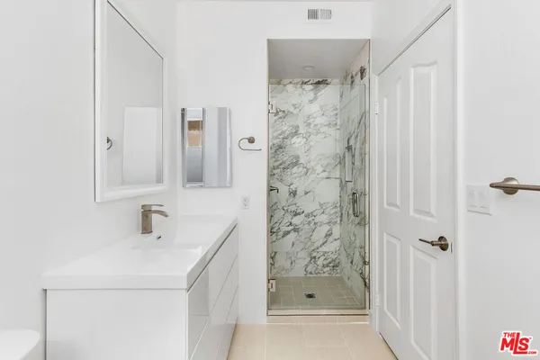 a view of an empty walk in closet