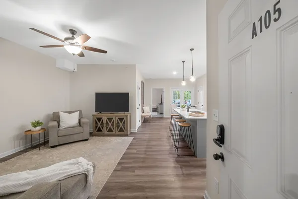 a living room with furniture and a flat screen tv