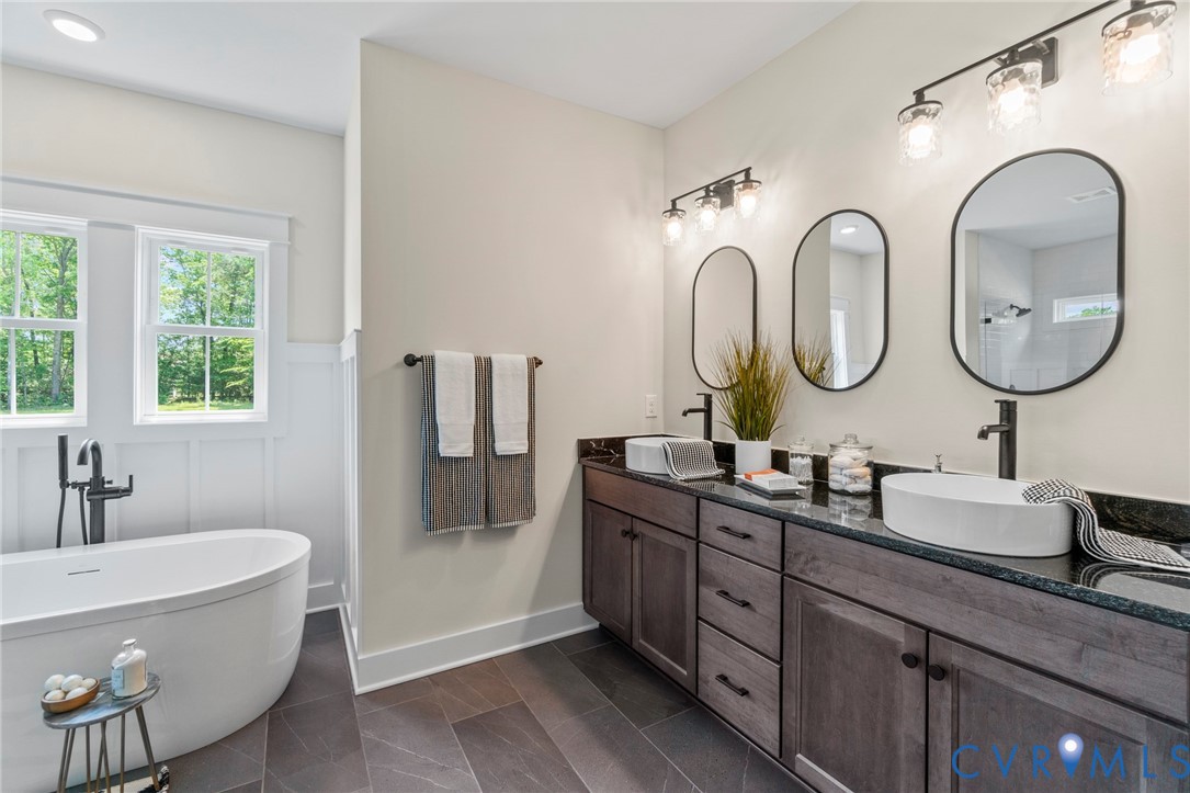 4891 Gooden Trail Quinton, VA 23141 - Photo 16 of 52 Bathroom with double vanity, a freestanding bath,