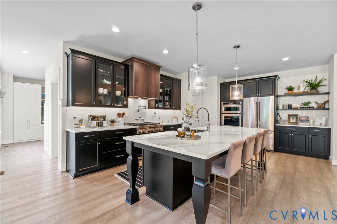 4891 Gooden Trail Quinton, VA 23141 - Photo 20 of 52 Kitchen featuring a kitchen bar, light stone count