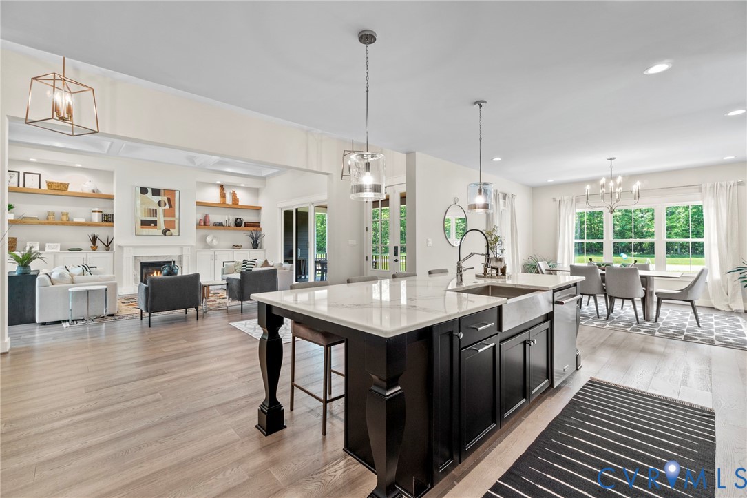 4891 Gooden Trail Quinton, VA 23141 - Photo 22 of 52 Kitchen with dark cabinetry, hanging lights, open