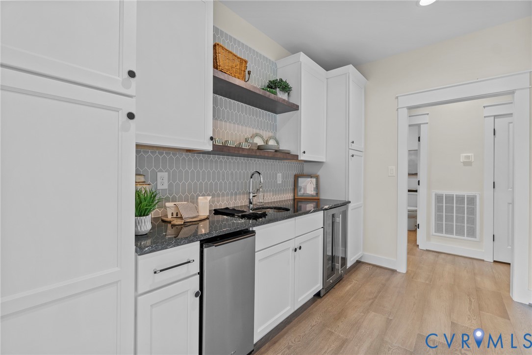 4891 Gooden Trail Quinton, VA 23141 - Photo 27 of 52 Kitchen with open shelves, dark stone countertops,