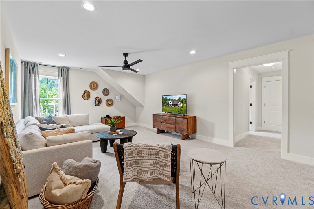 4891 Gooden Trail Quinton, VA 23141 - Photo 32 of 52 Living area featuring light carpet, ceiling fan, a