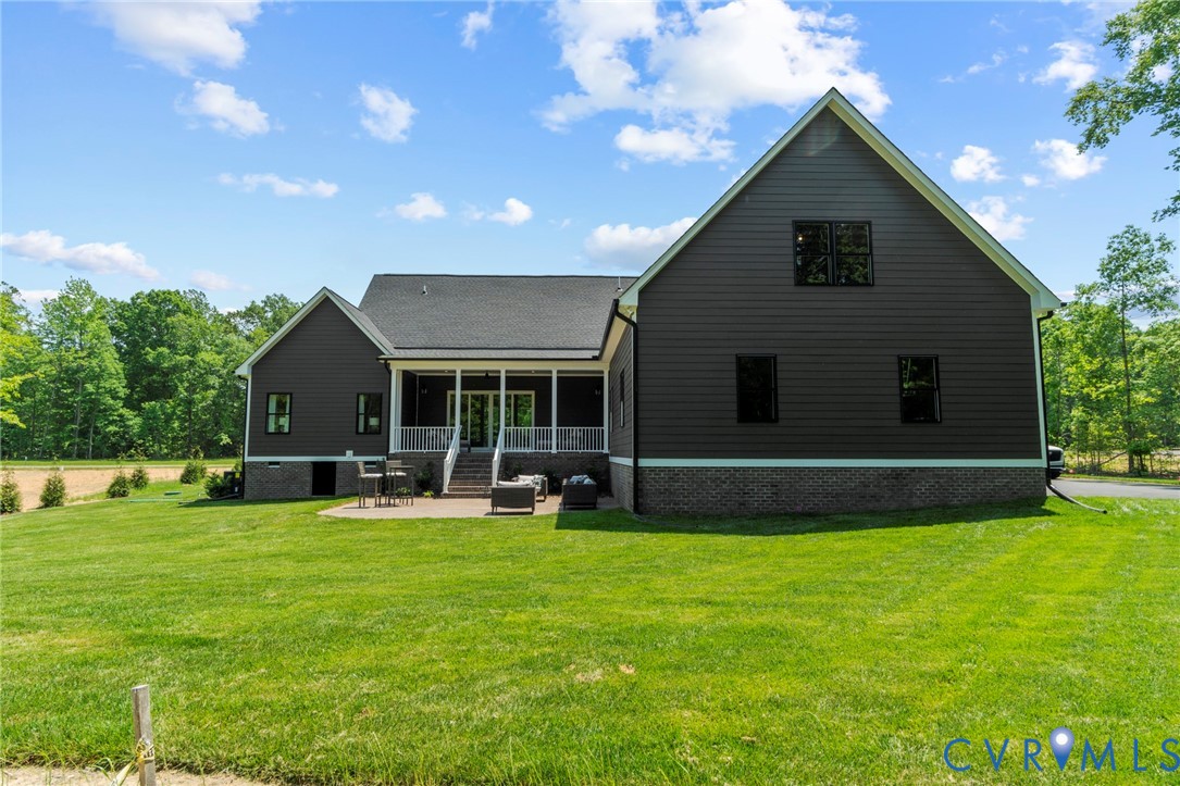 4891 Gooden Trail Quinton, VA 23141 - Photo 48 of 52 Back of property featuring a lawn, a porch, and a