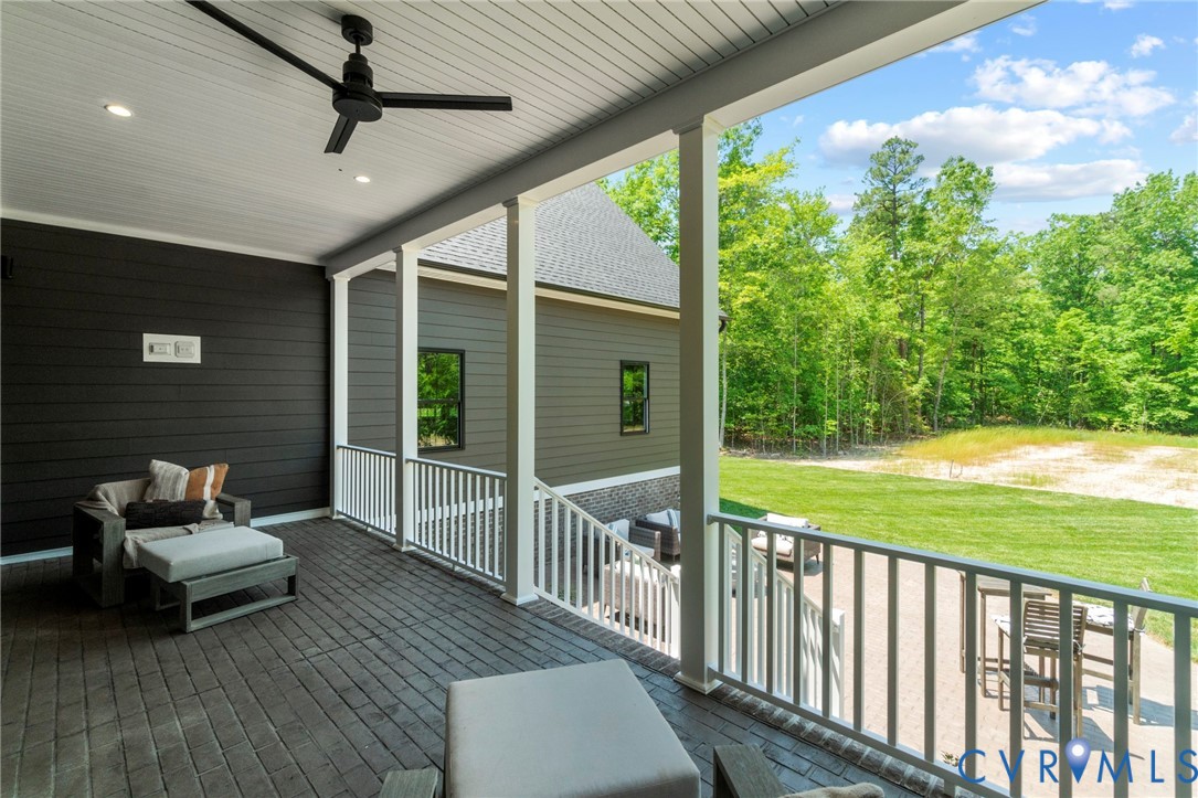 4891 Gooden Trail Quinton, VA 23141 - Photo 52 of 52 Deck featuring a ceiling fan, a yard, and a patio