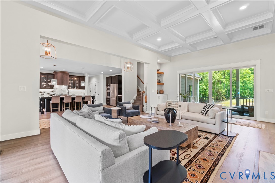 4891 Gooden Trail Quinton, VA 23141 - Photo 9 of 52 Living room with hanging lights, light wood-style