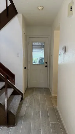 a terrace with a sink and cabinets