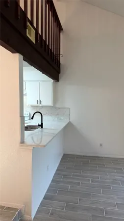 a view of a kitchen with sink and dishwasher