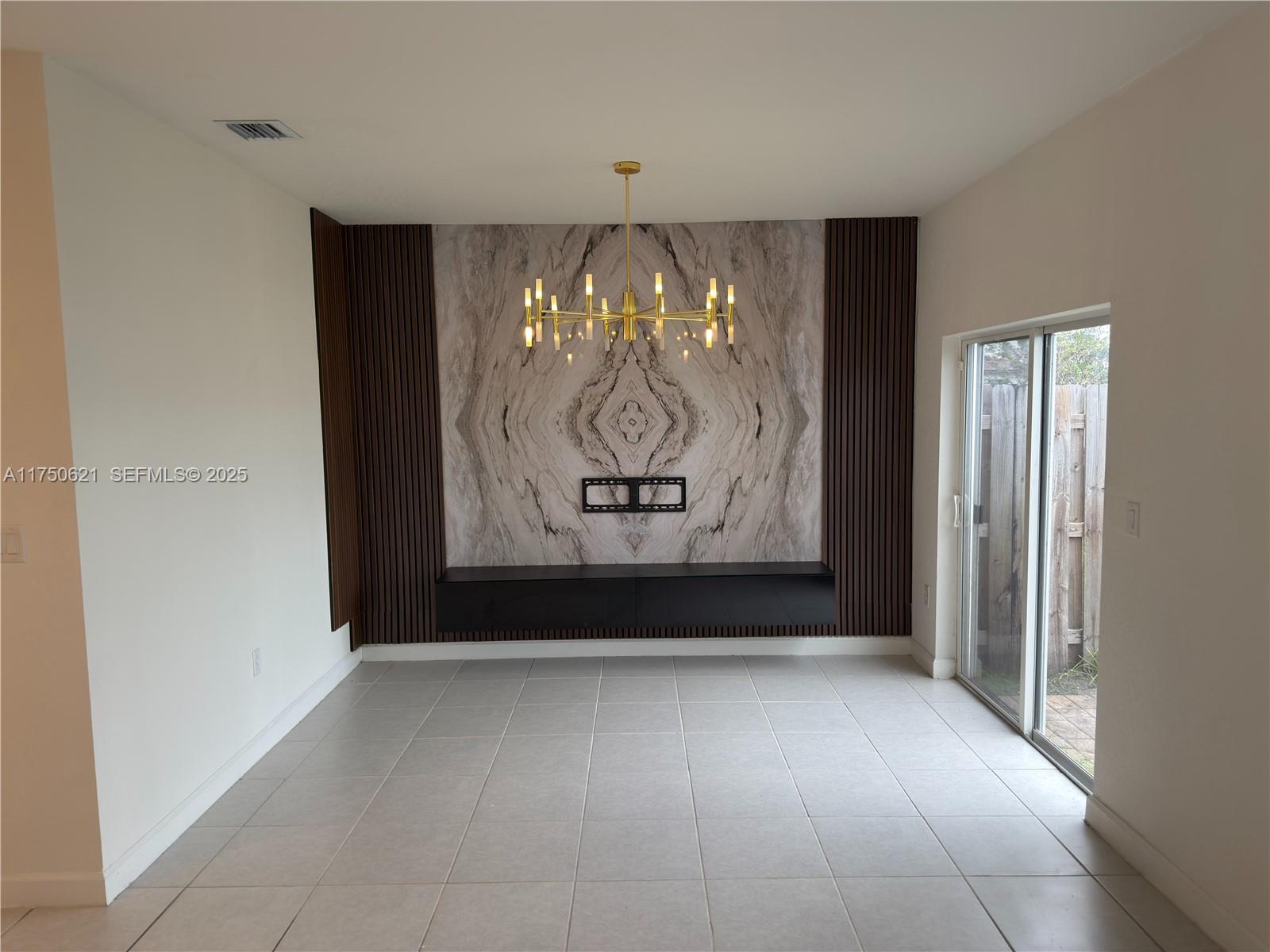 12909 Northwest 23rd Place, Unit 12909 Miami, FL 33167 - Photo 14 of 34 a view of painting on the wall