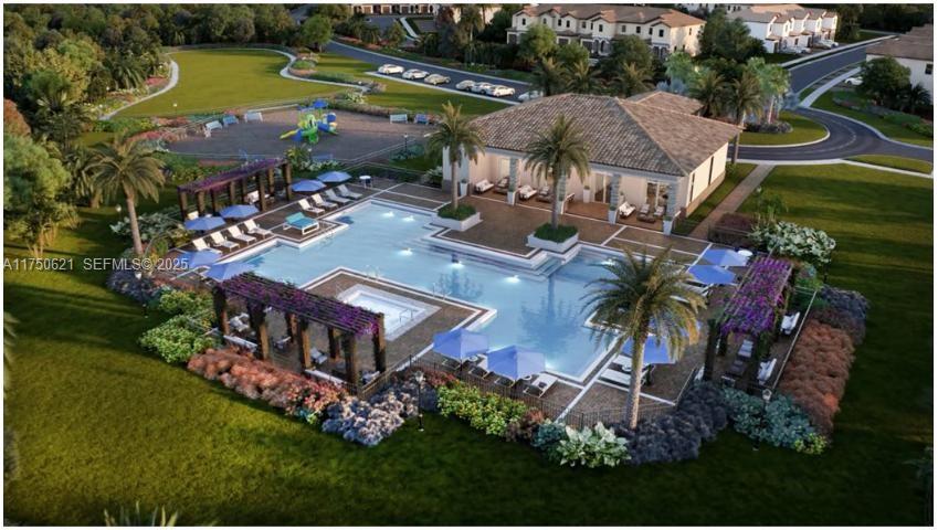 12909 Northwest 23rd Place, Unit 12909 Miami, FL 33167 - Photo 2 of 34 an aerial view of a house with garden space and lake view