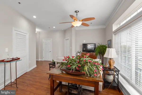 a view of a dining room with furniture window and wooden floor
