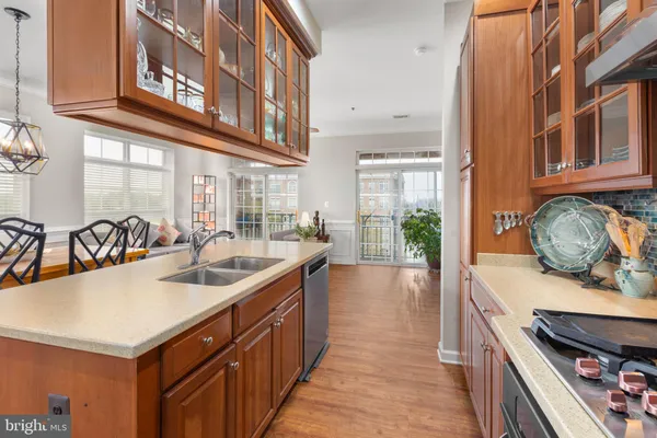 a kitchen with lots of counter top space and stainless steel appliances