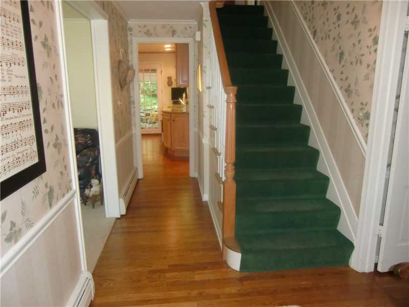 2 Revere Road Riverside, CT 06878 - Photo 13 of 13 a view of a hallway with wooden floor and staircase